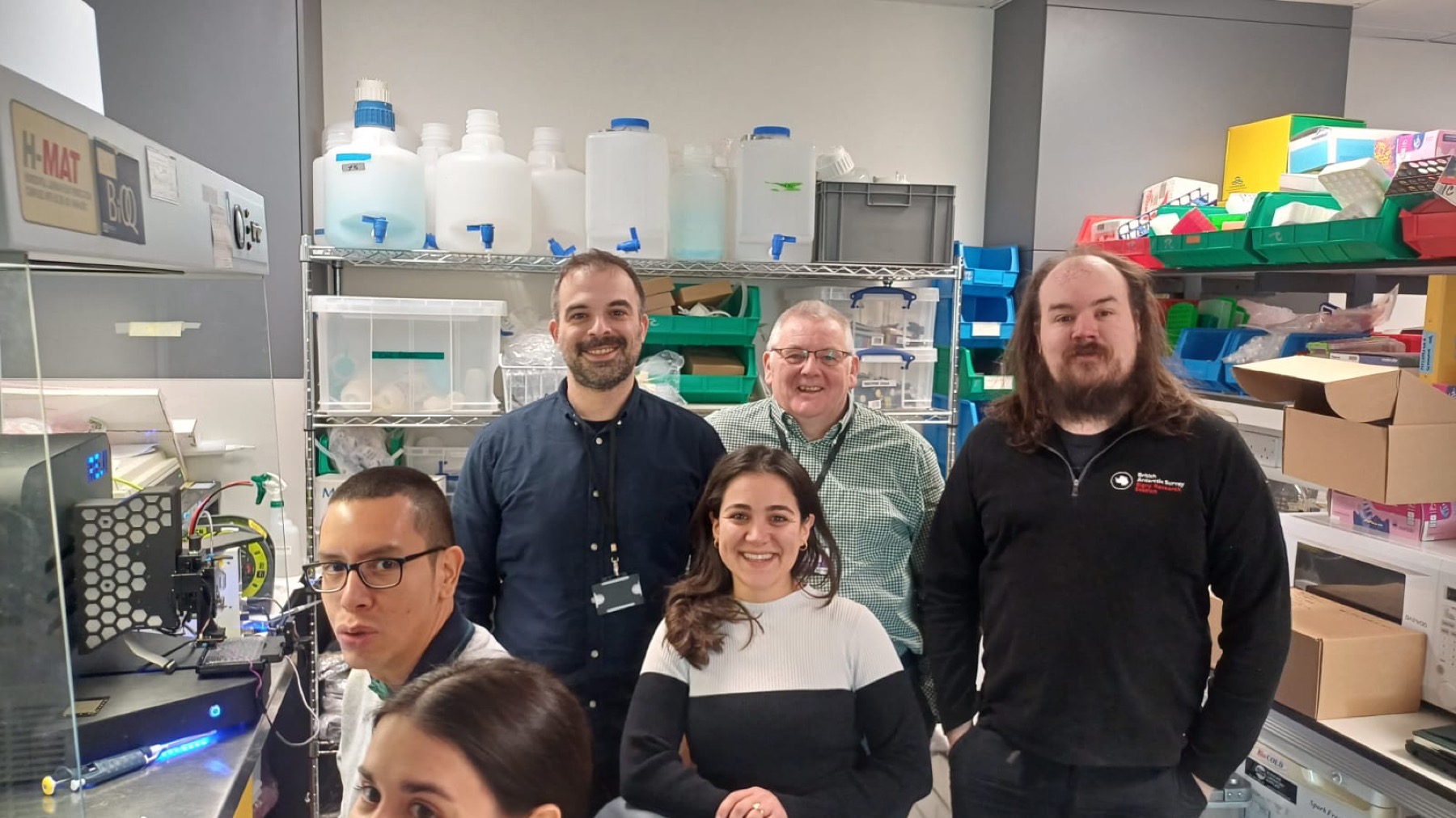 University and JetBio researchers collaborating in a laboratory